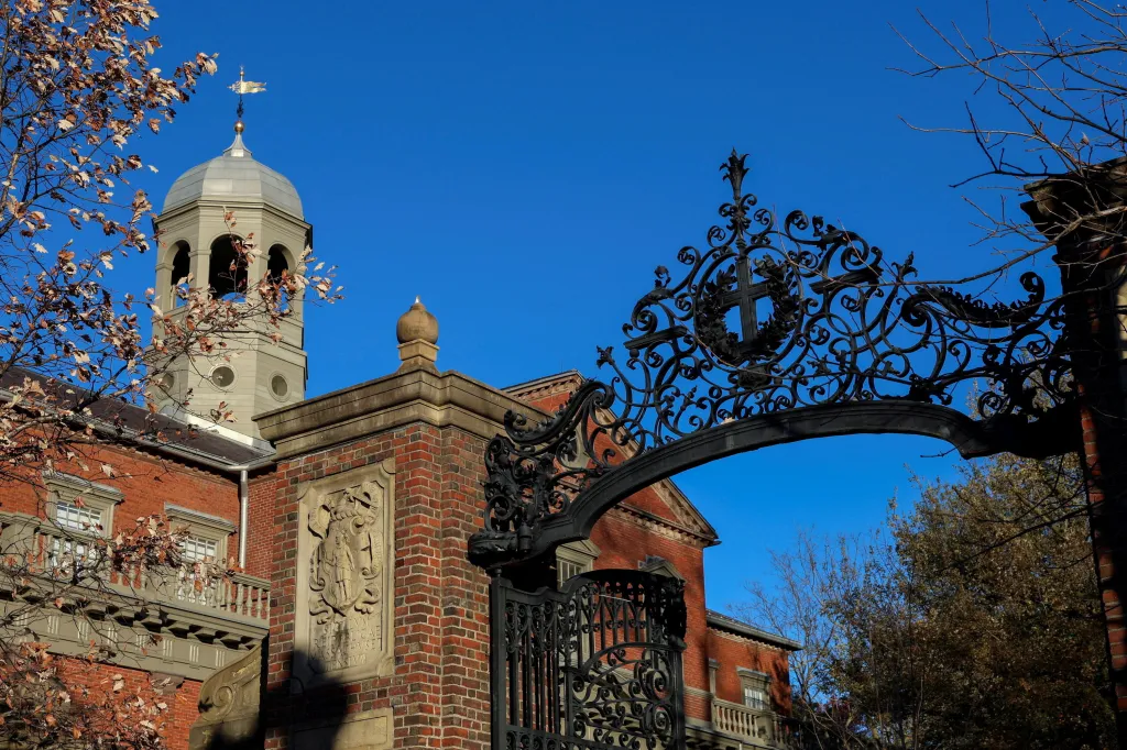 Harvard University campus building with a decorative gate and tower.
