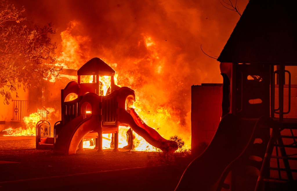 A playground burns in a residential neighborhood during the Eaton fire in Pasadena, California on January 7, 2025.