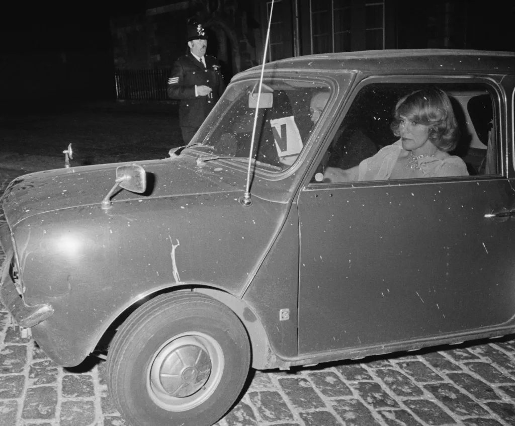 Camilla Parker-Bowles in the front passenger seat of a car in April 1976.