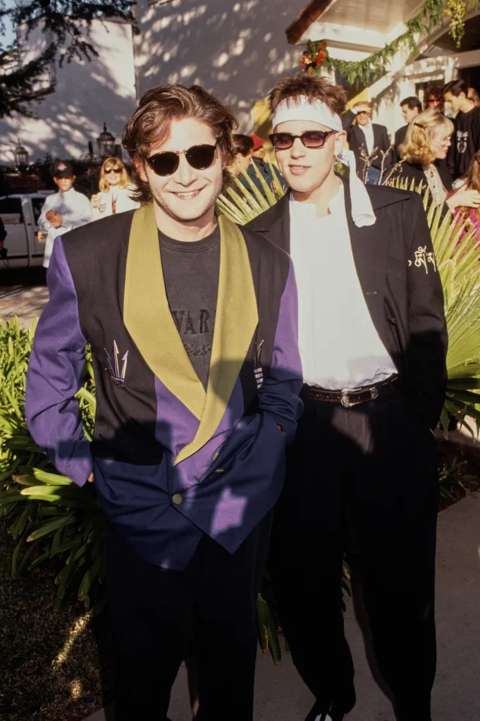 American actor Corey Feldman (left) and Canadian actor Corey Haim attend the Second Annual Toys For Tots Benefit at Hancock Park in Los Angeles, Calif