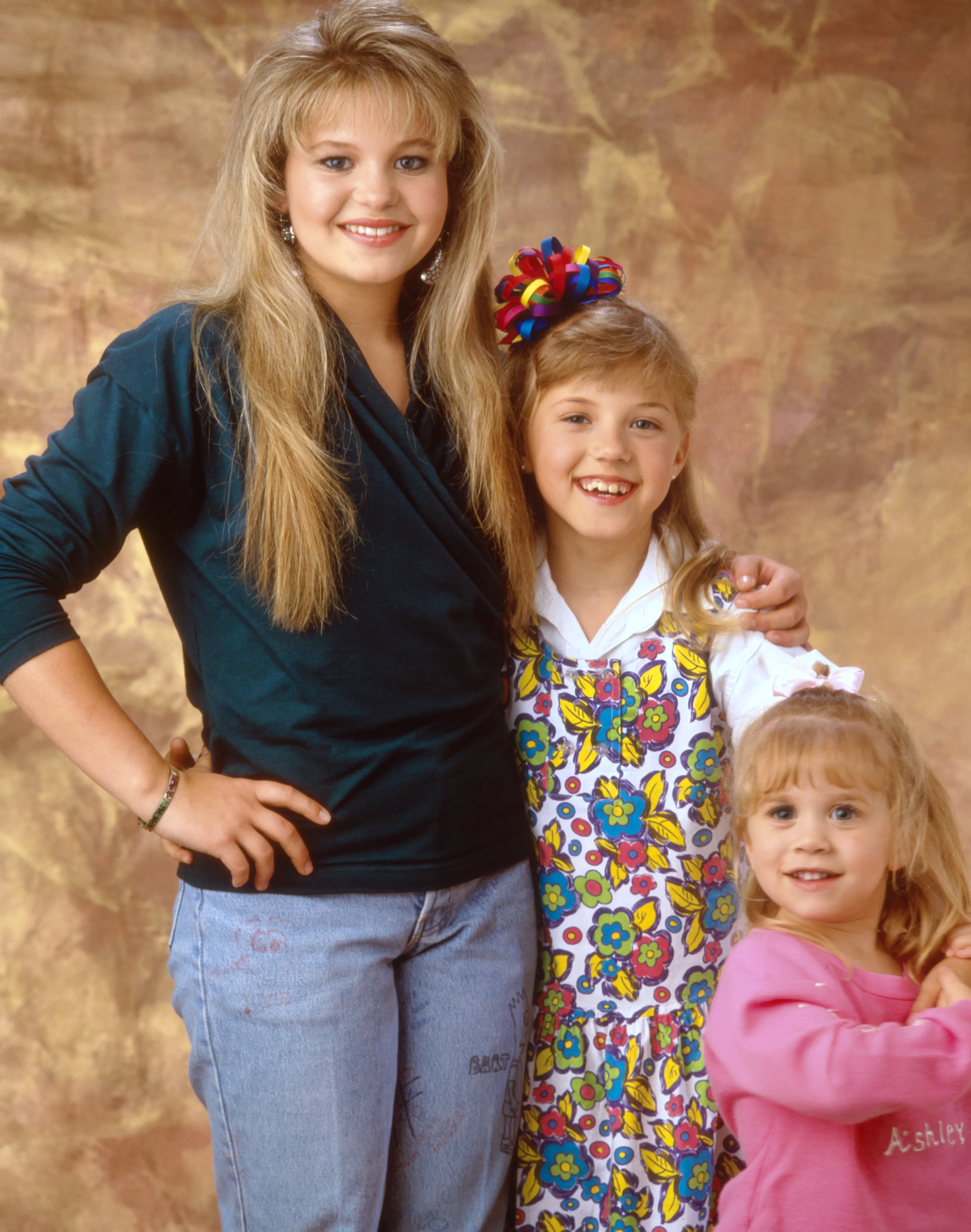 Candace Cameron, Jodie Sweetin, and Ashley Olsen from Full House.