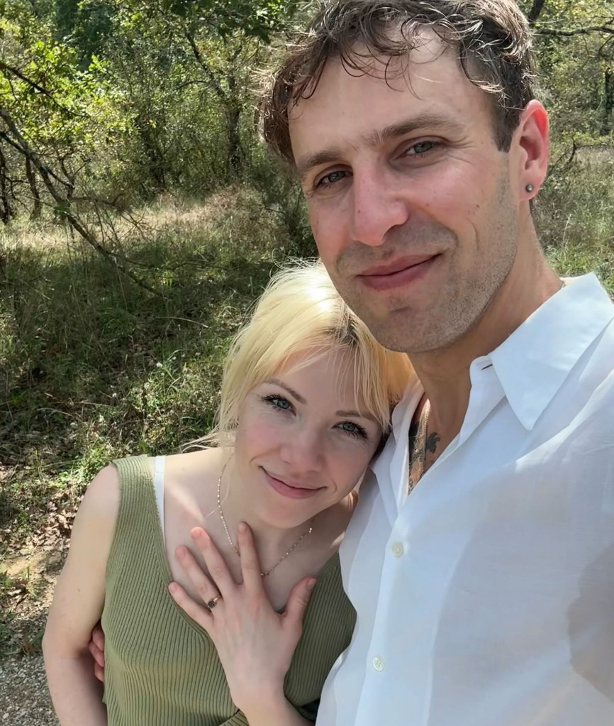 Carly Rae Jepsen and Cole M.G.N. posing for a selfie outdoors.