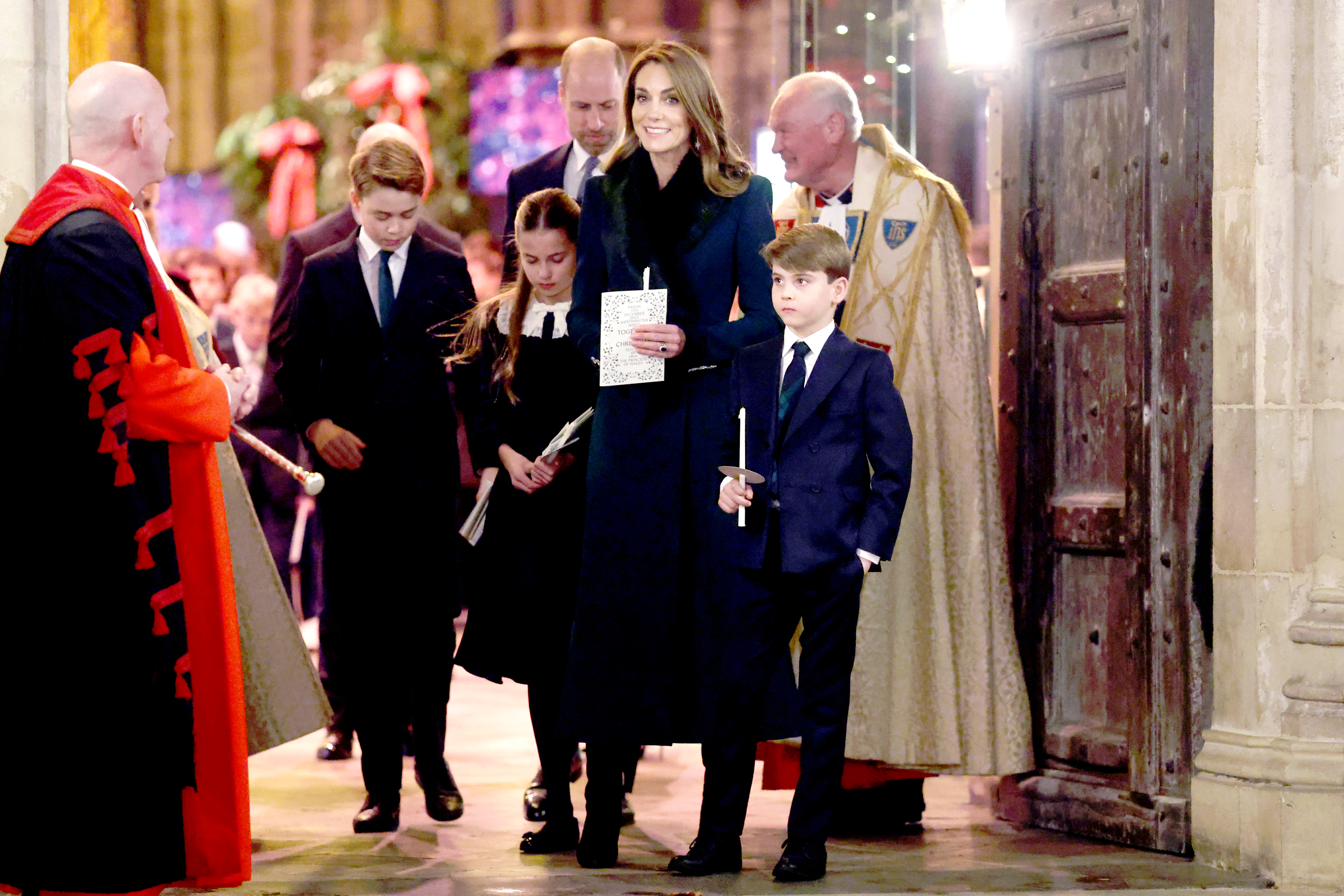 Catherine, Princess of Wales, with Prince William, Prince George, Princess Charlotte, and Prince Louis at a Christmas carol service.