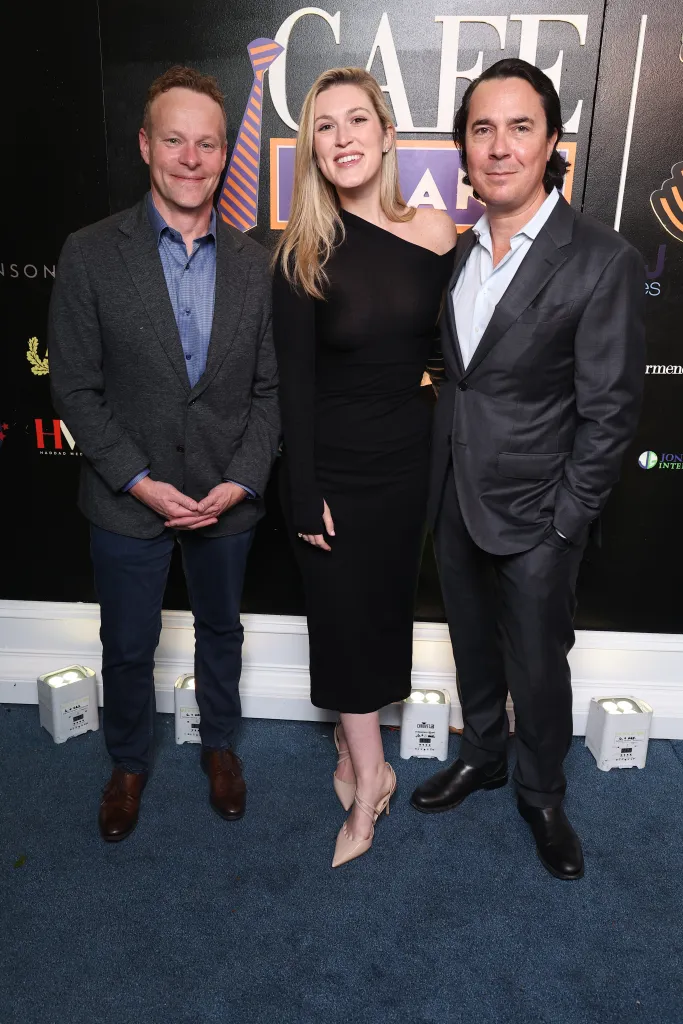 Chris Licht, in a grey suit and blue shirt, Olivia Nuzzi, in a black dress and Ryan Lizza, in a grey suit and white shirt, at Cafe Milano's 30th Anniversary Party