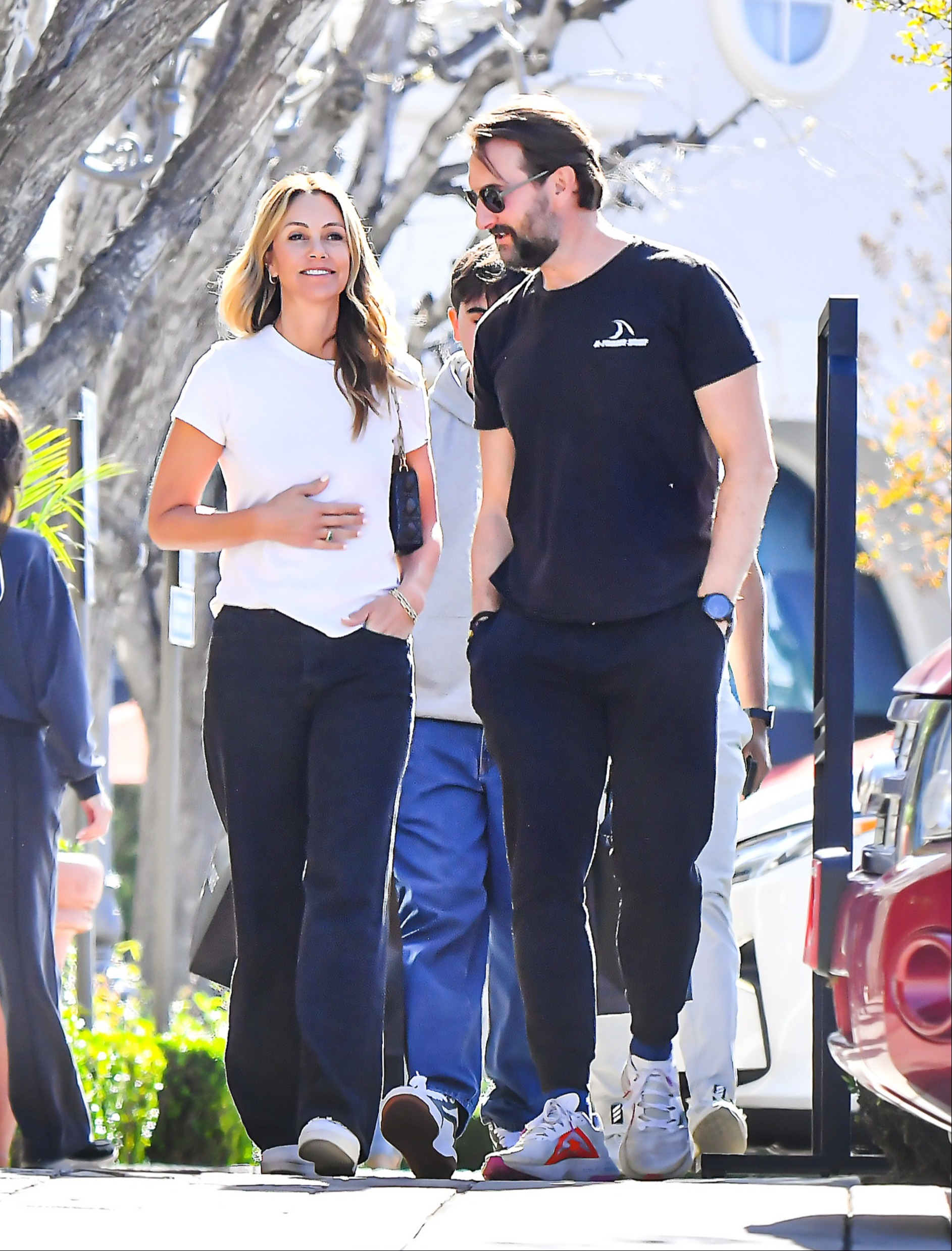 Christine Baumgartner and Josh Connor walking together.
