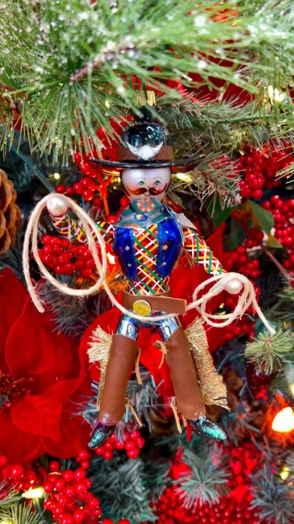 A cowboy Christmas tree ornament by Christopher Radko.