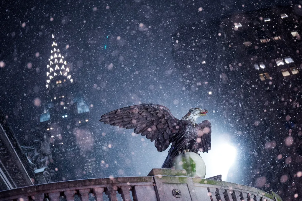 The Chrysler Building shines in the background as snow falls on Grand Central Station in NYC on Dec. 26, 2025.
