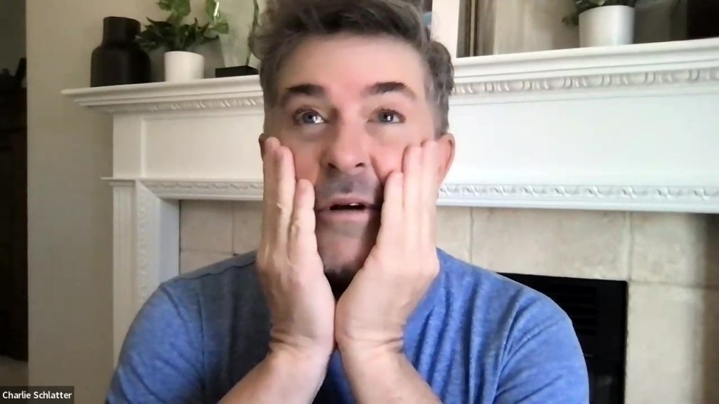 A man in a blue shirt.