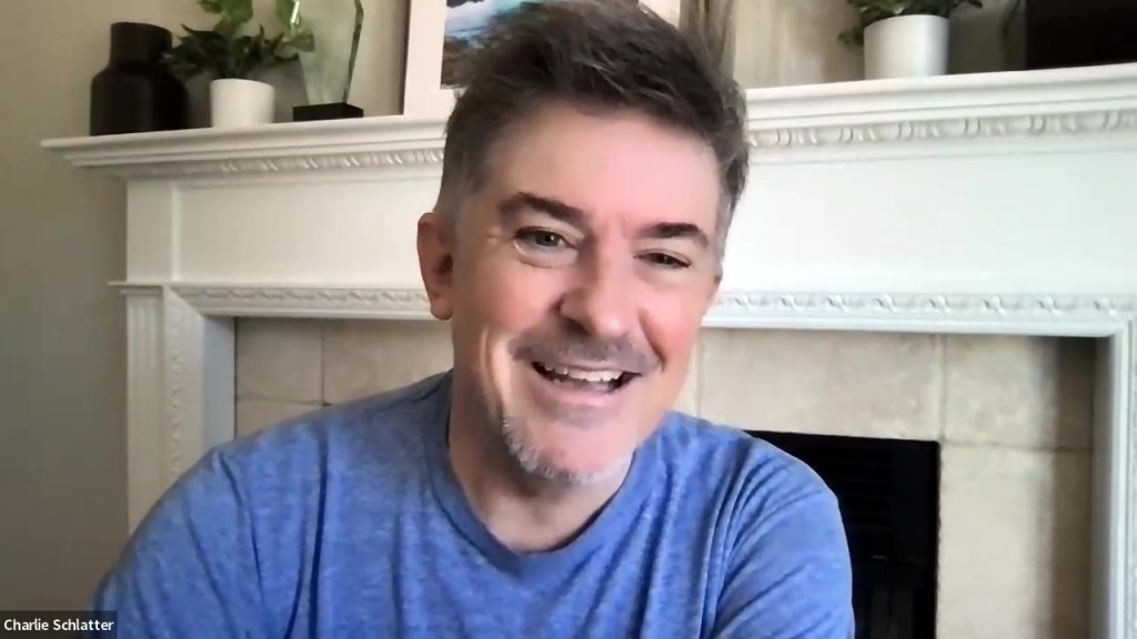 A man in a blue shirt.