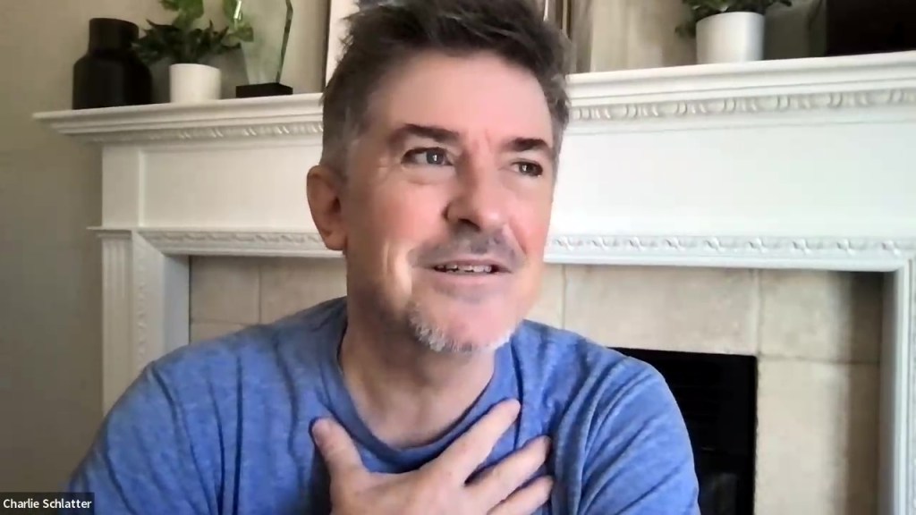 A man in a blue shirt.