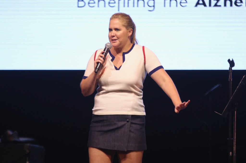 Comedian Amy Schumer performs on stage.