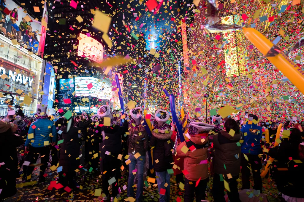 Confetti falls on revelers in Times Square during New Year's festivities.