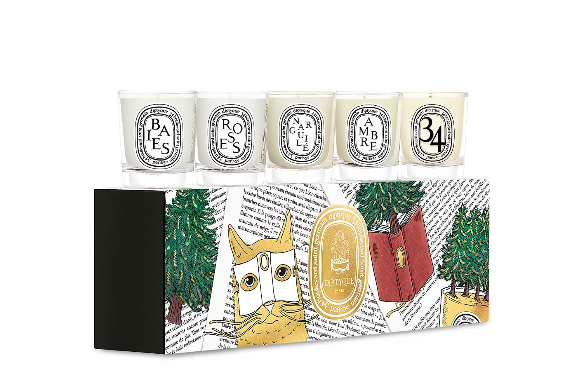 Five miniature Diptyque scented candles sit on top of a decorative box illustrated with a cat wearing a crown and pine trees.