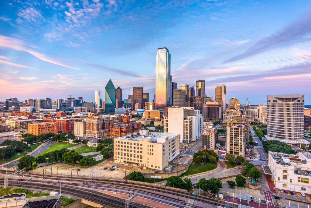 Dallas, Texas, USA downtown city skyline at dusk.