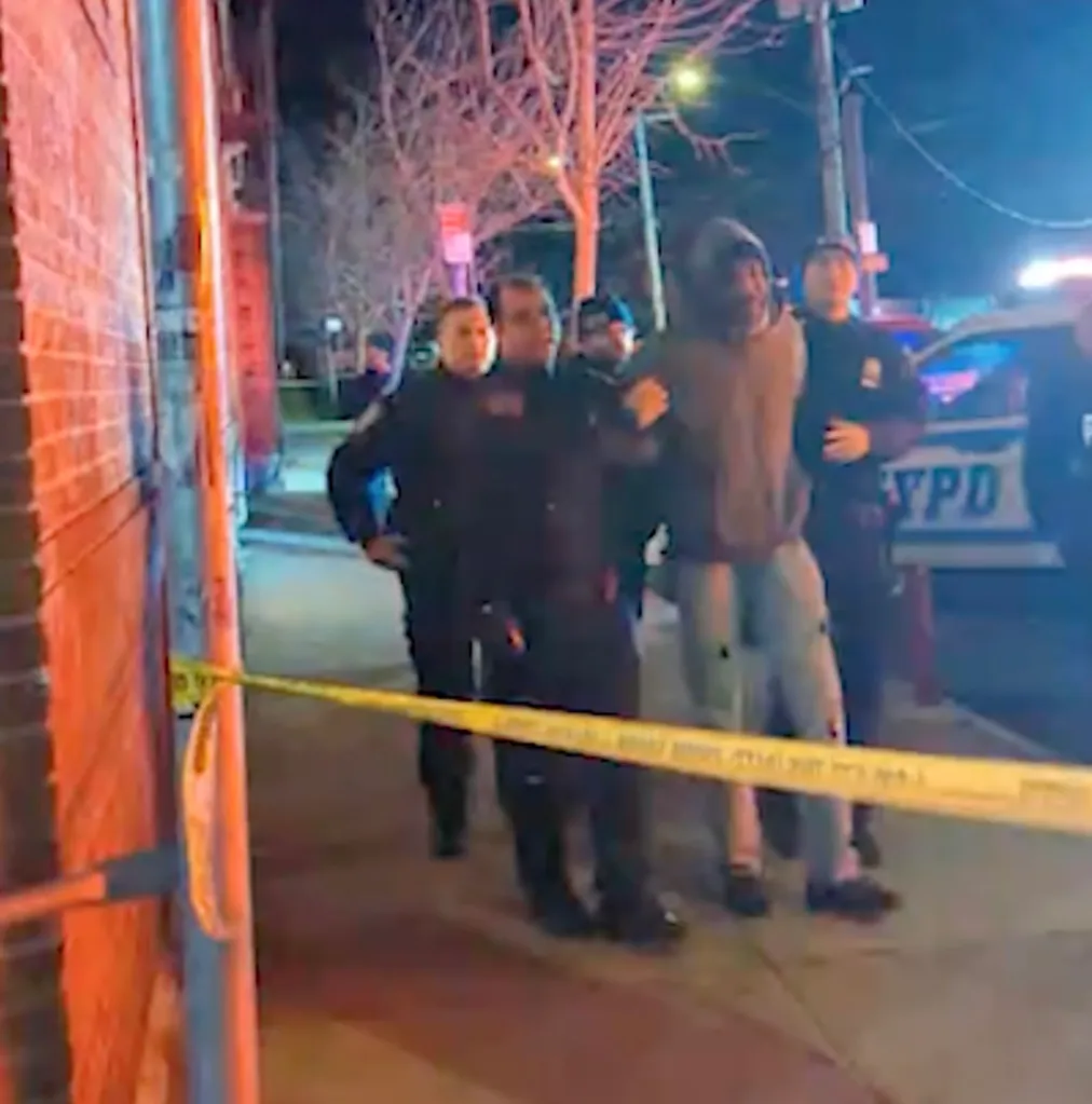 Police escorting Kevin Fray, 51, with his hands behind his back at the scene of a fatal police shooting.