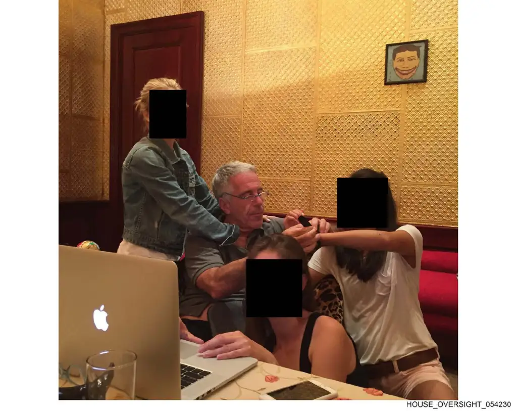 Epstein with several women in an office.