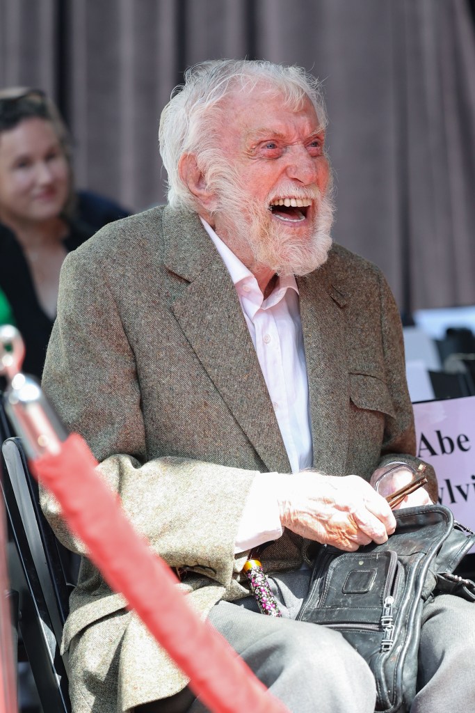 Dick Van Dyke laughing at Carol Burnett's Hand and Footprint Ceremony.