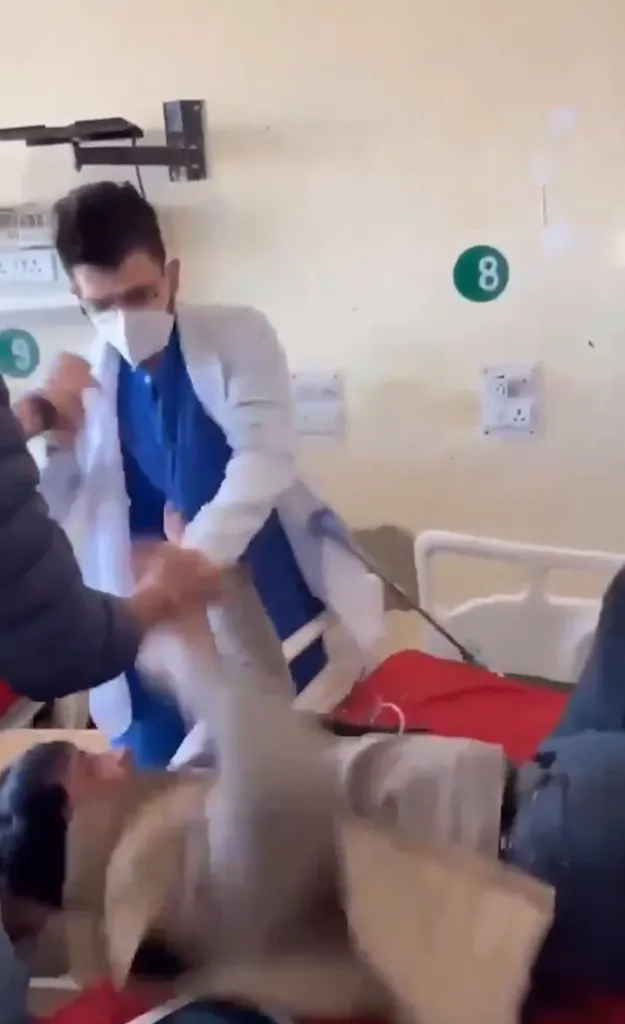 Doctor suspended for repeatedly punching a patient in a hospital room.