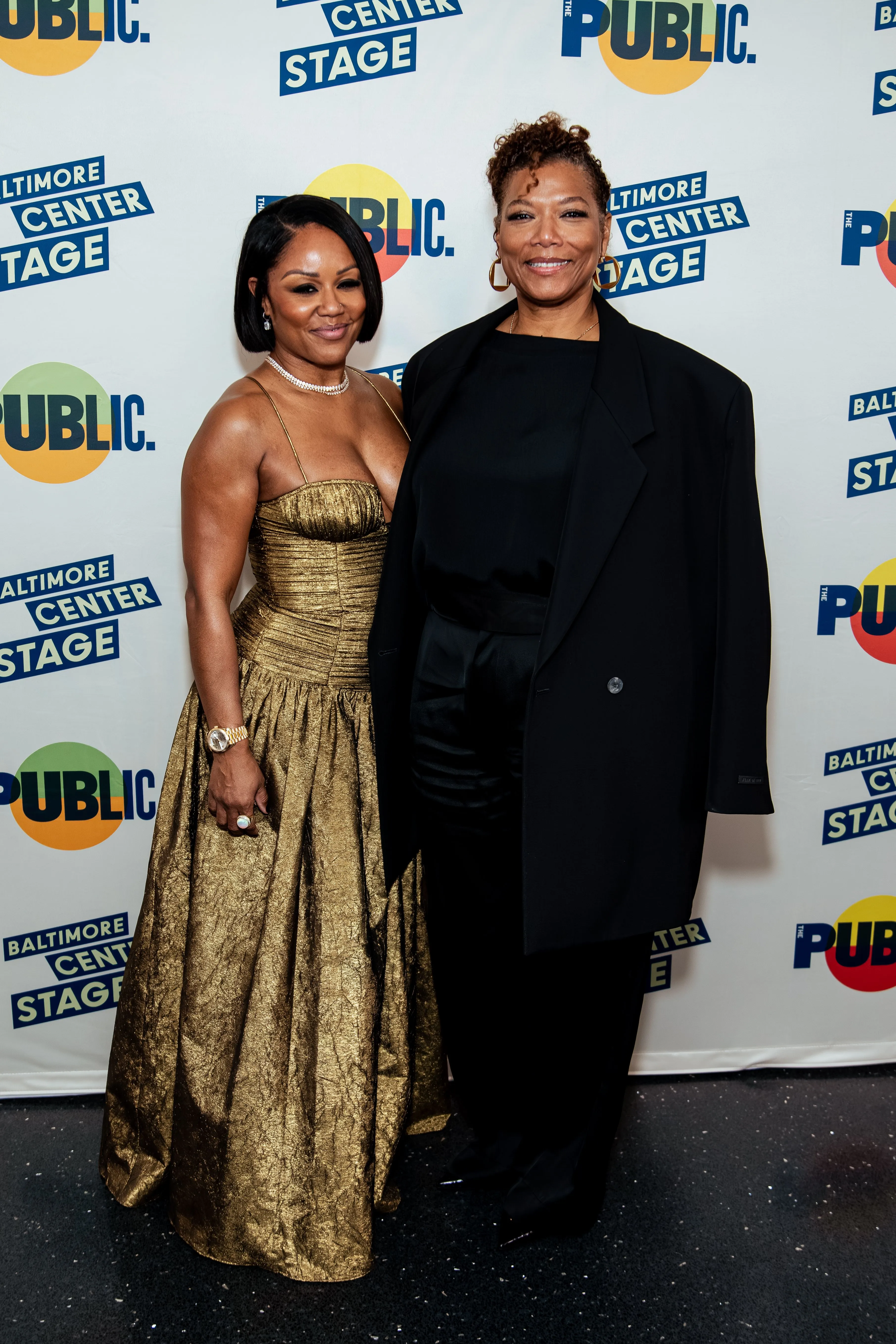 Eboni Nichols and Queen Latifah pose for a photo.