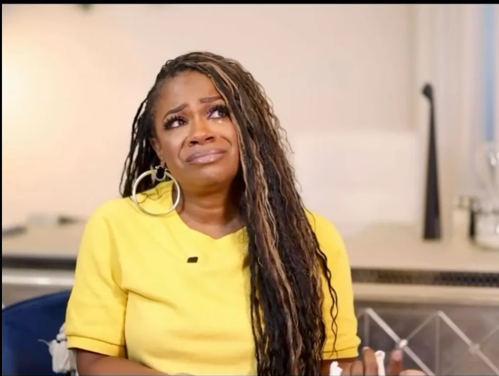 Kandi Burruss crying with tears on her cheeks.