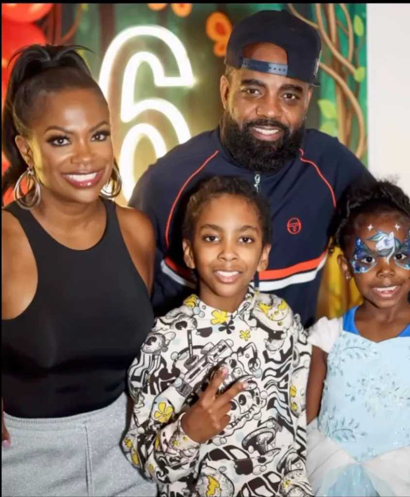 Kandi Burruss and Todd Tucker with their children, Ace and Blaze, at a birthday party.
