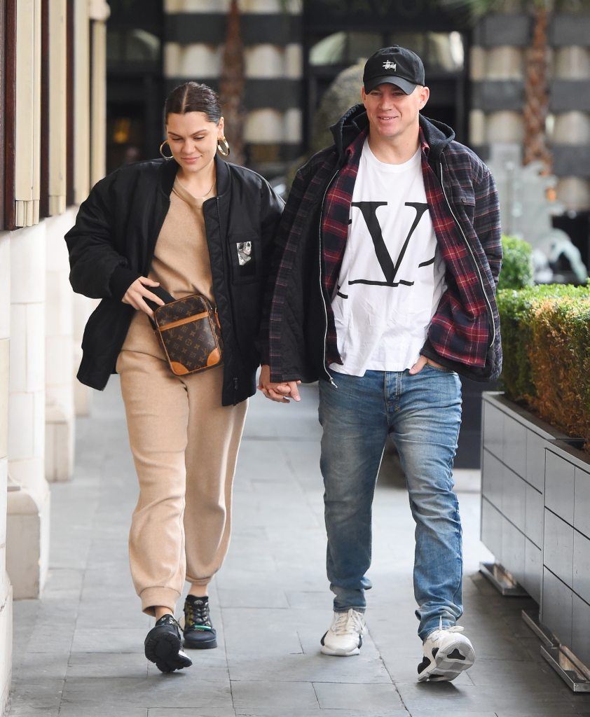 Jessie J and Channing Tatum holding hands while walking outside.