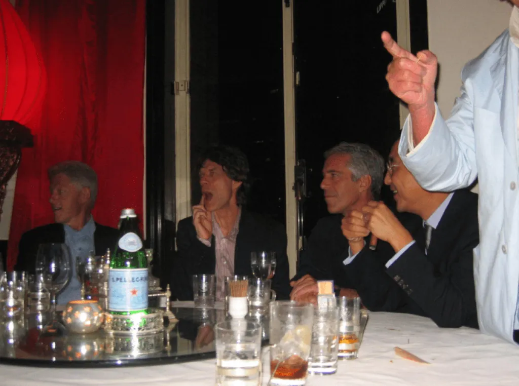 Bill Clinton, Mick Jagger, Jeffrey Epstein, and another man dining at a table.