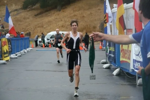Erica Fox, a triathlete, crossing the finish line.