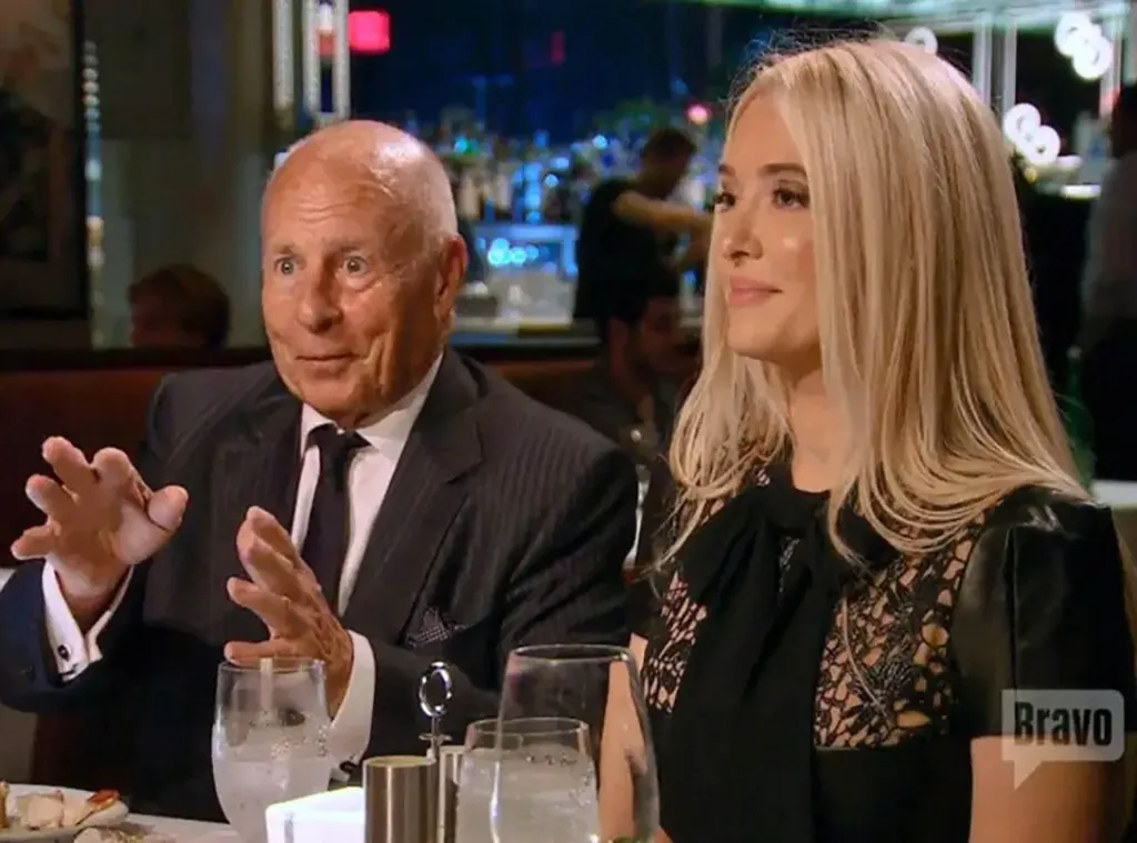 Erika Jayne and Tom Girardi seated at a restaurant table.