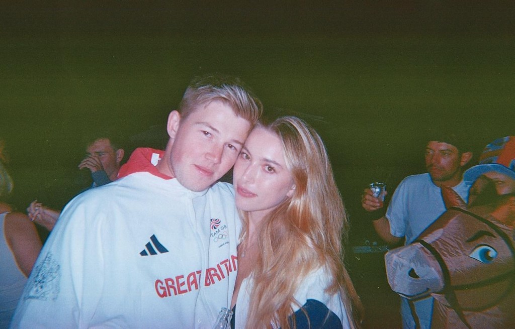 Eve Jobs and Harry Charles posing together.