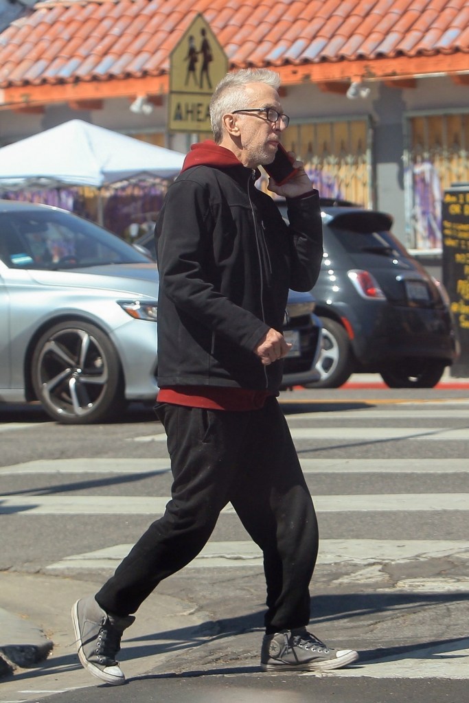 Andy Dick walking and talking on his phone on Melrose Ave in Hollywood.