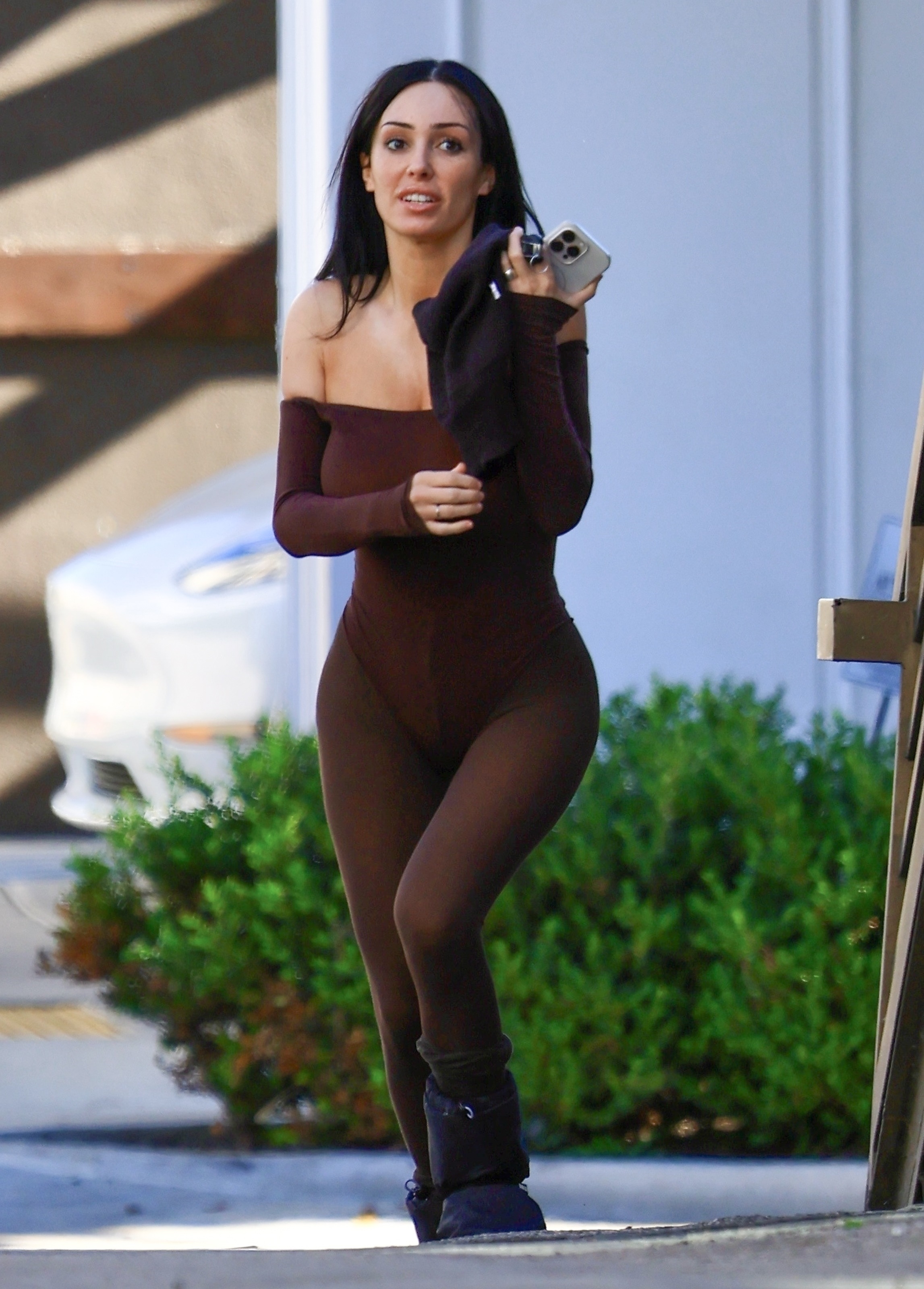 Bianca Censori in a brown bodysuit and moon boots.