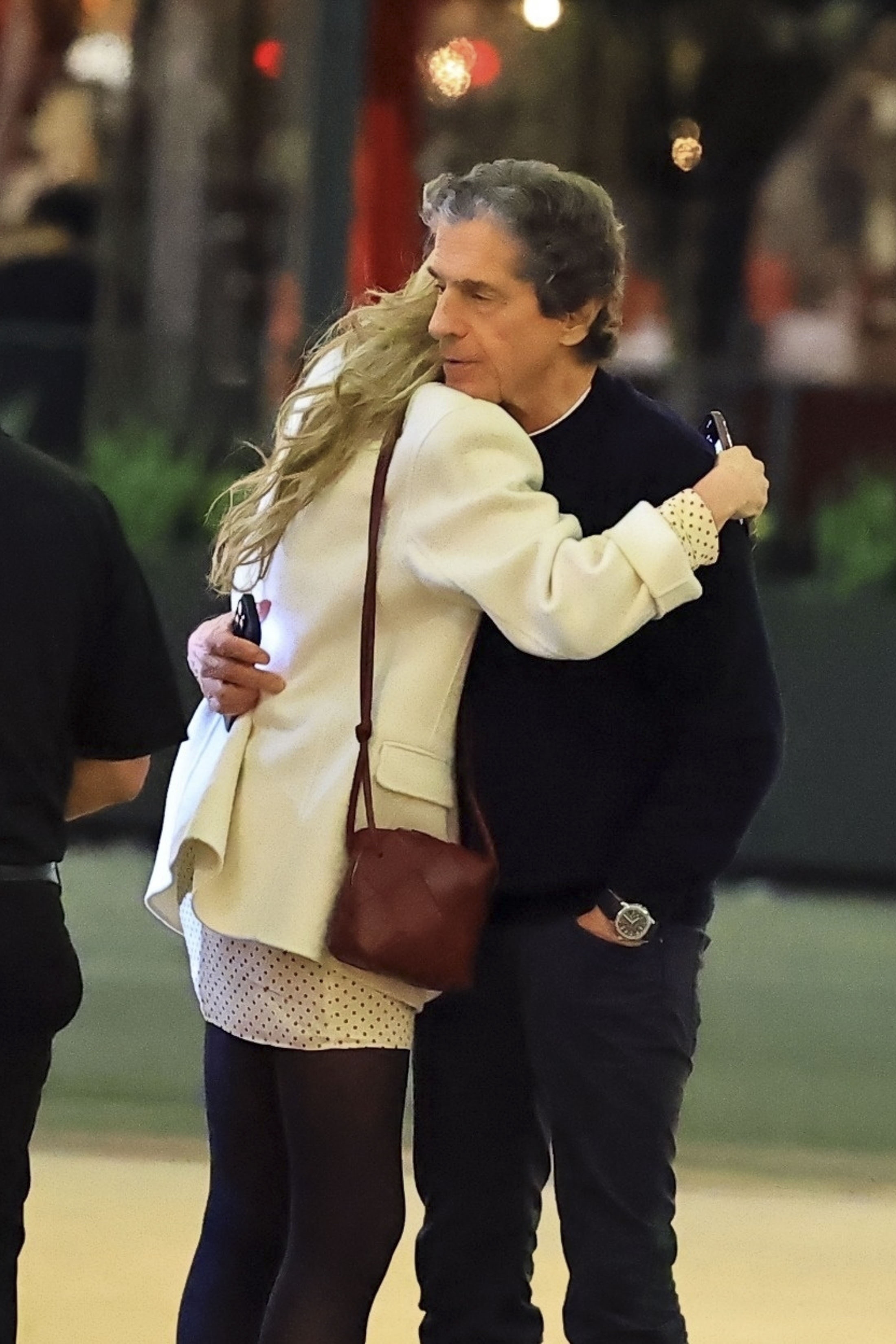 Rebecca Gayheart hugging Peter Morton at E-Baldi.