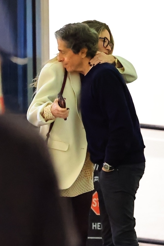 Rebecca Gayheart hugging Peter Morton.