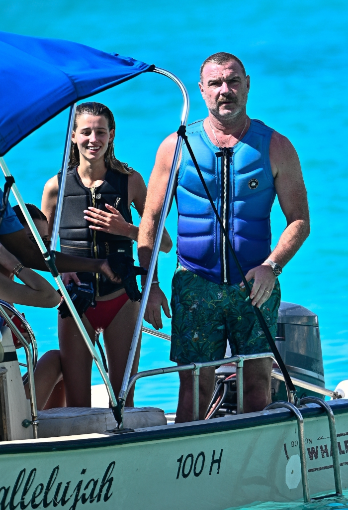 Liev Schreiber and his son are on a boat in Barbados.