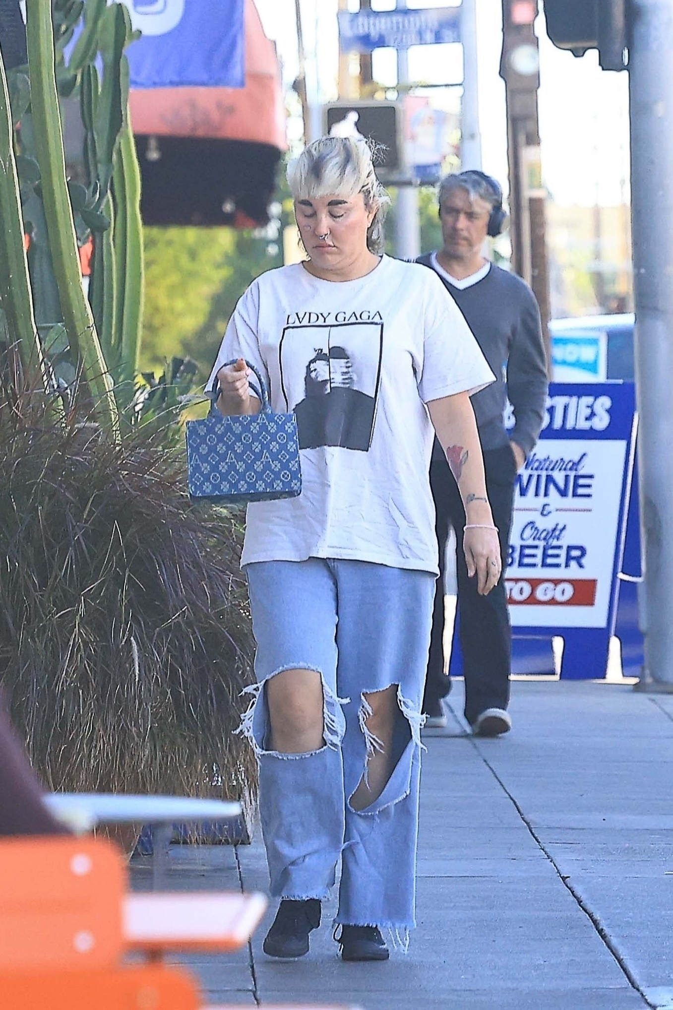 Amanda Bynes walking down a sidewalk in Los Angeles.