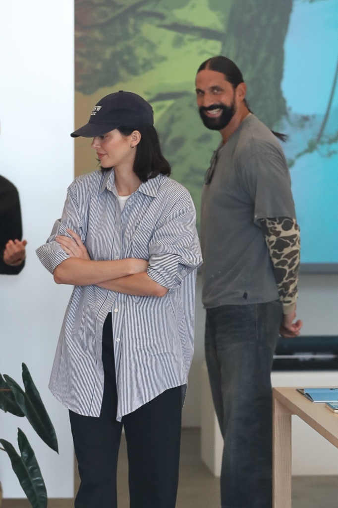 Kendall Jenner in a striped shirt and Ben Gorham in a grey shirt and camouflage sleeves.