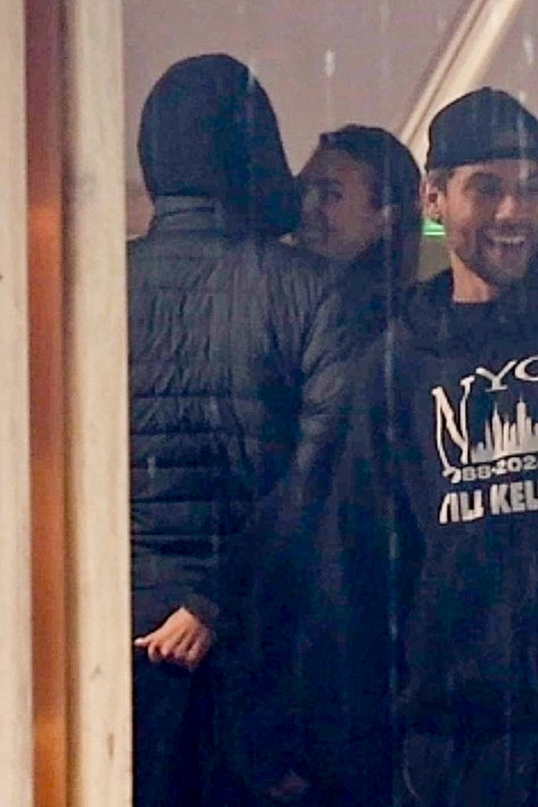 Leonardo DiCaprio and Vittoria Ceretti kissing while shopping.