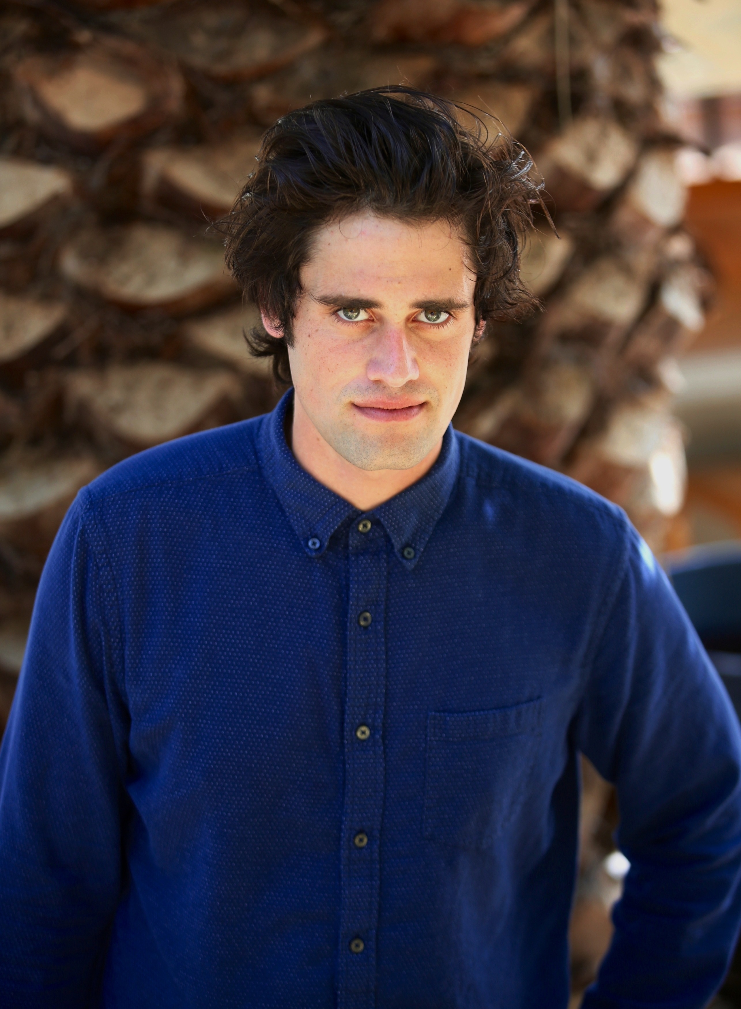Portrait of actor Nick Reiner in a blue button-down shirt.
