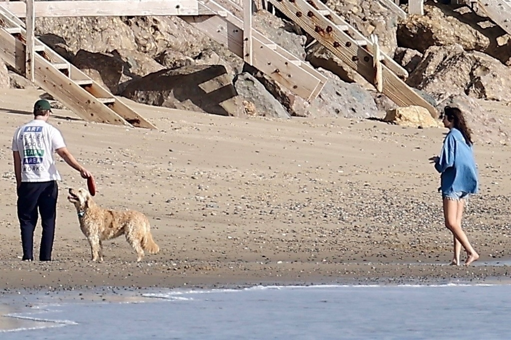 Alex Siliberg, Romy Reiner, and their dog at Malibu beach.