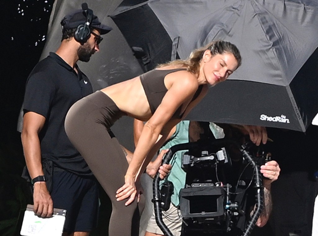 Gisele Bündchen filming a commercial in a brown workout set on Miami Beach.