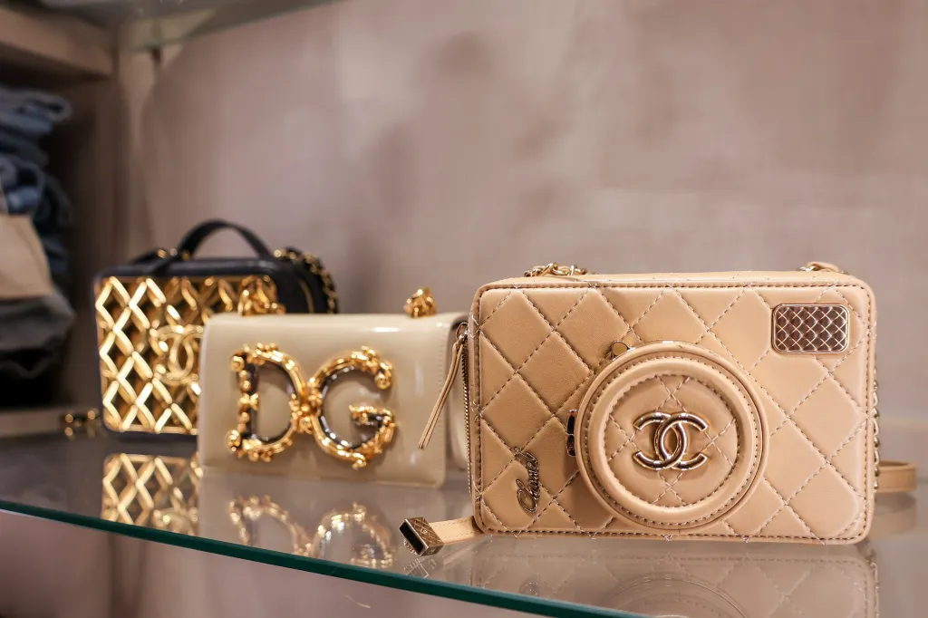 Three designer handbags from Dolce & Gabbana and Chanel.