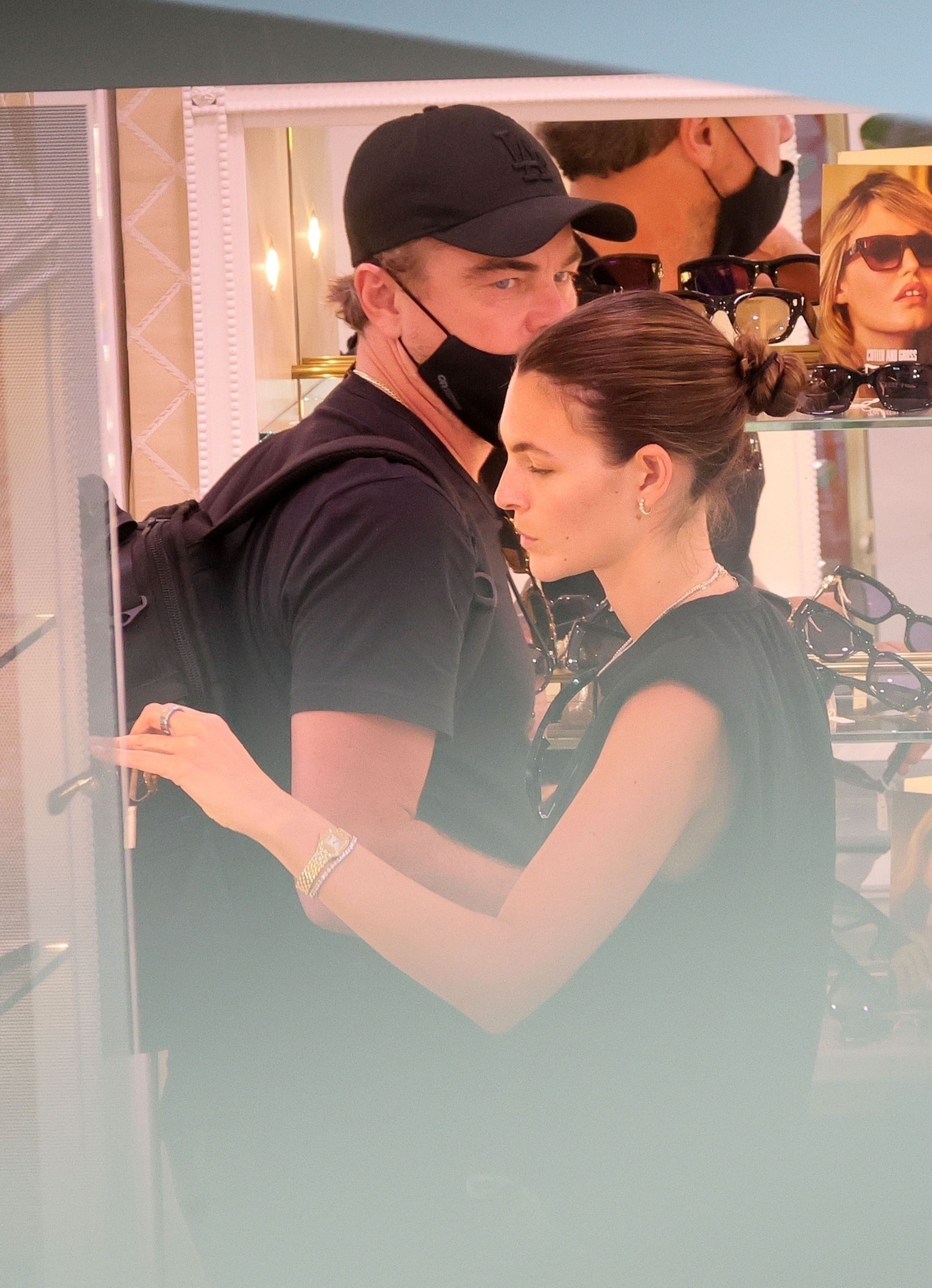 Leonardo DiCaprio and Vittoria Ceretti shopping for sunglasses.