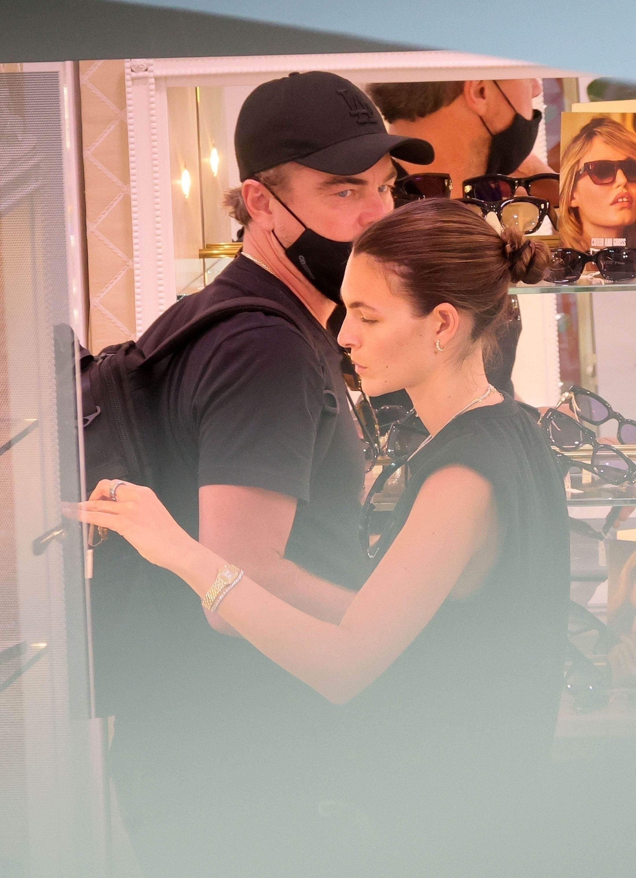 Leonardo DiCaprio and Vittoria Ceretti shopping for sunglasses.