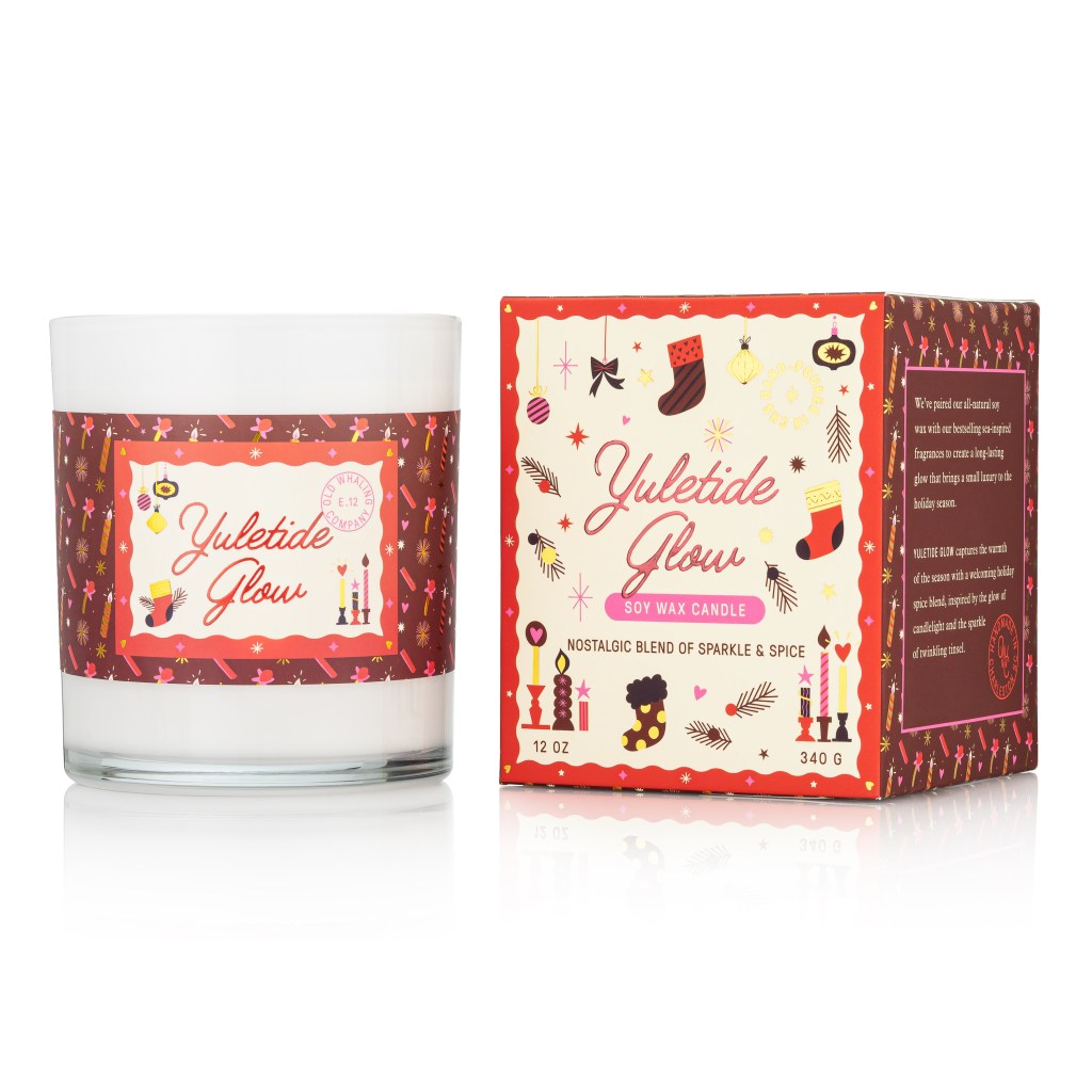 Yuletide Glow Soy Wax Candle by Old Whaling Co with a holiday-themed box.