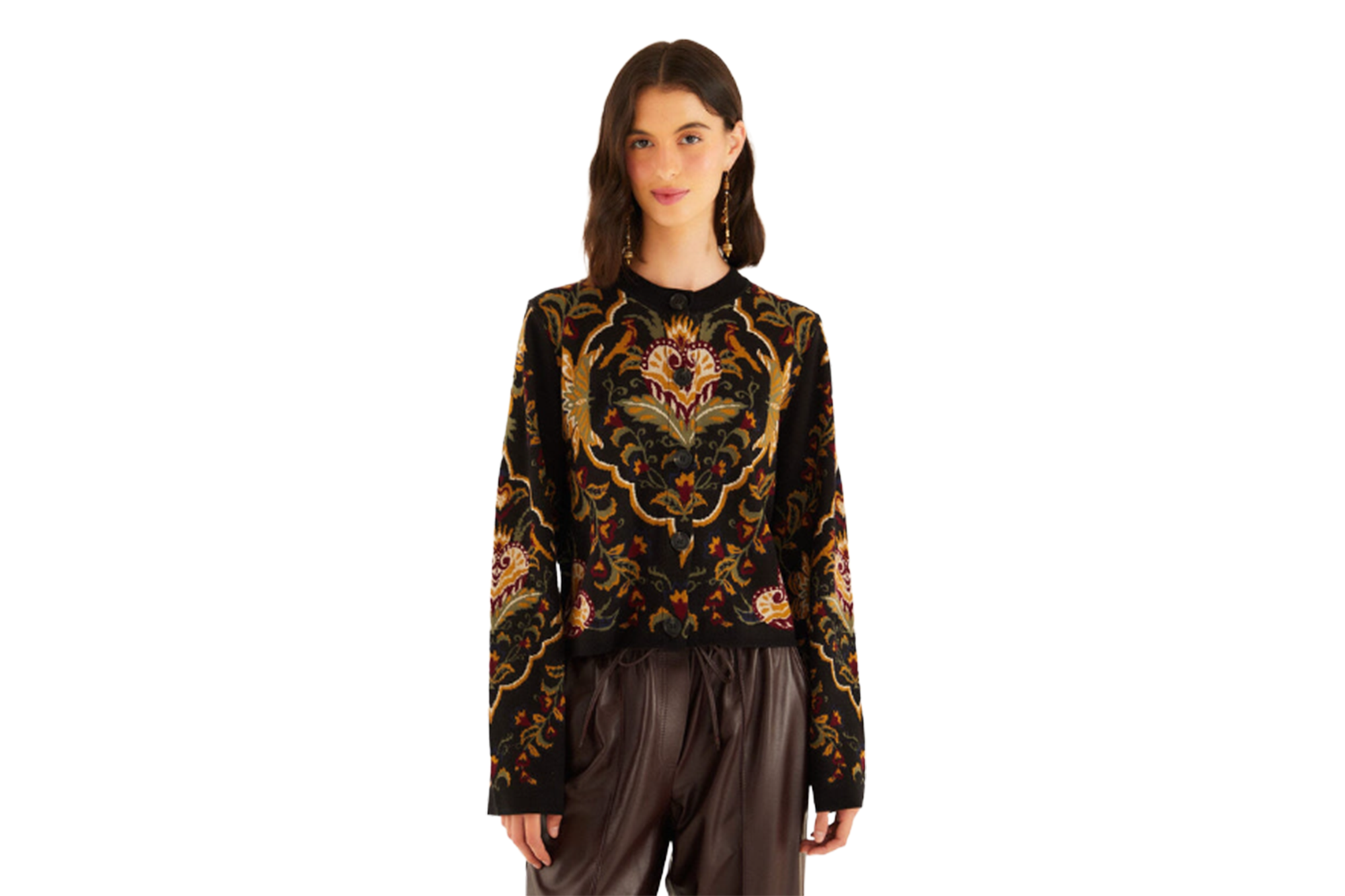 Model wearing black cardigan with intricate floral embroidery.