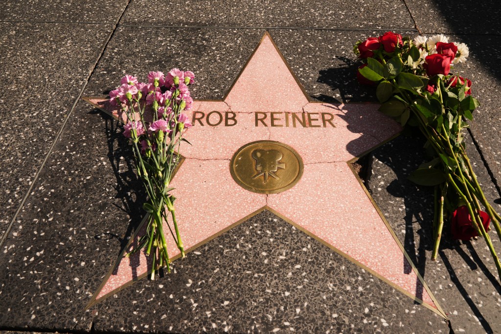 Flowers covering Rob Reiner's Walk of Fame star.