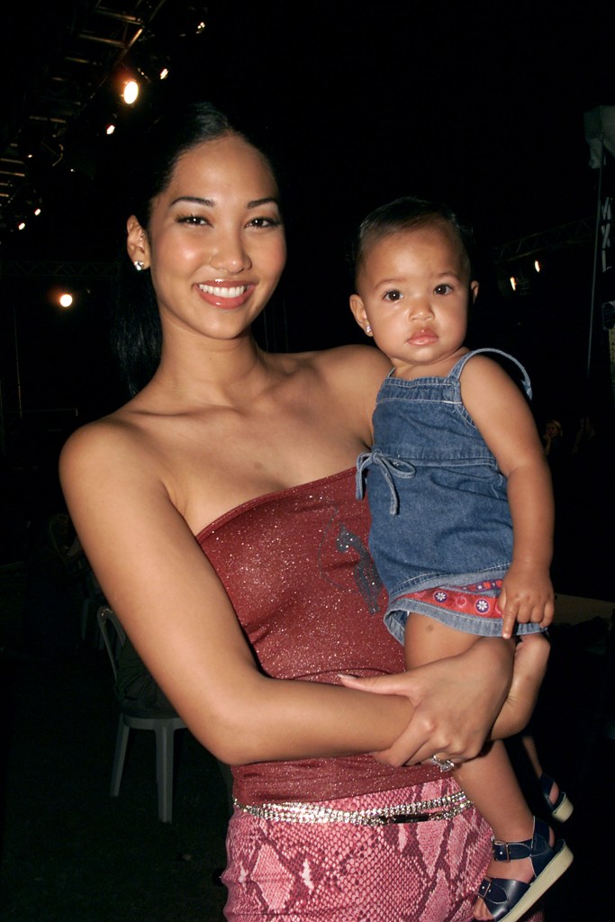 Kimora Lee Simmons holding her daughter Ming.