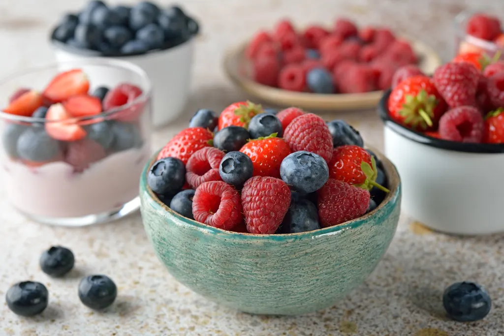 Bowl of fresh strawberries, raspberries, and blueberries.