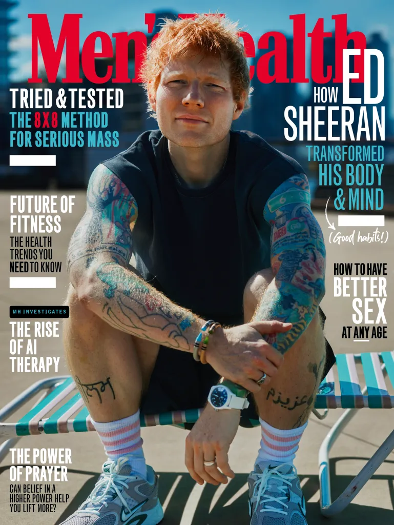 Ed Sheeran on the cover of Men's Health UK, sitting on a chair, with text about transforming his body and mind.